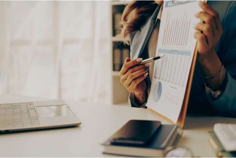 Person looking over their accounting charts.